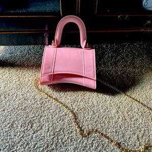 Never used - Mini, rubberized sling bag